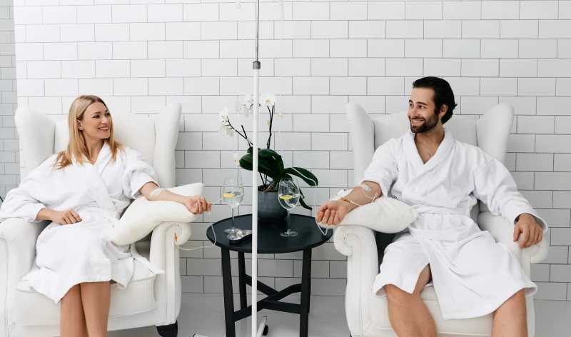 Couple rejuvenating with iv for hangover relief